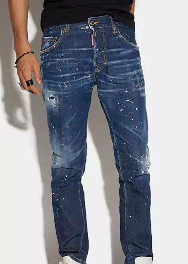 Jeans Dsquared2 en denim de coton stretch, coupe slim. Délavage usé avec détails effet vieilli et éclaboussures colorés