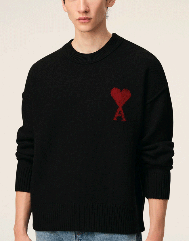 Pull Ami De Coeur bleu en laine et coton à col rond.
